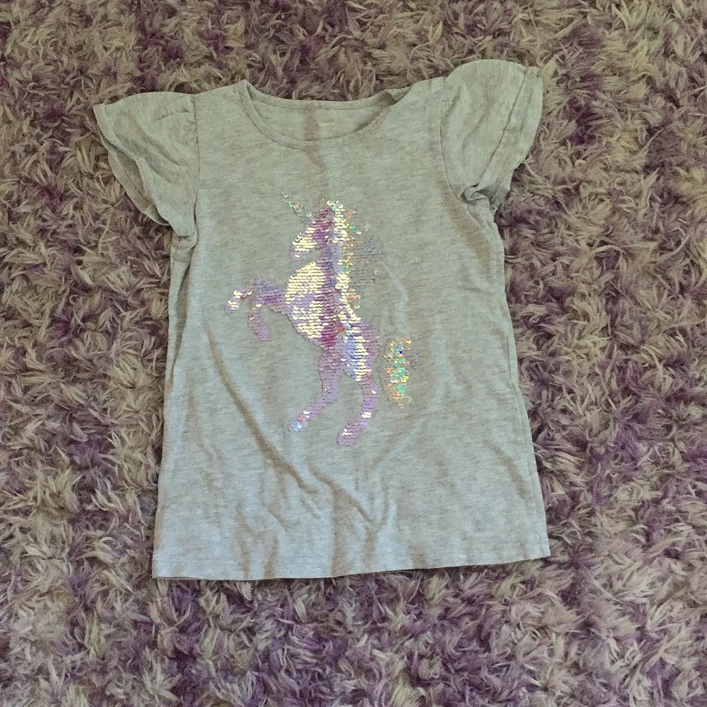 Unicorn flip shirt.